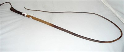 Lot 1056 - A Drover's Whip, made from the spine of a rhinoceros, with leather grip