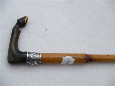 Lot 1059 - A Walking Stick, the horn handle carved into a horses leg and hoof, inset with an ivory shoe,...