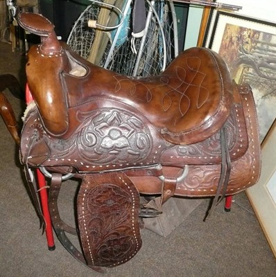 Lot 1072 - A Leather Western Saddle, with swollen pommel and horn, the seat with fancy stitched...