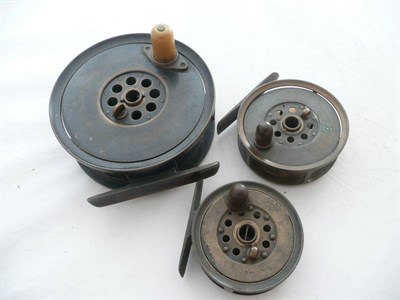 Lot 1131 - Three Brass Fly Reels by J.B. Moscrop of Manchester:- 4 1/2inch salmon reel with horn handle...