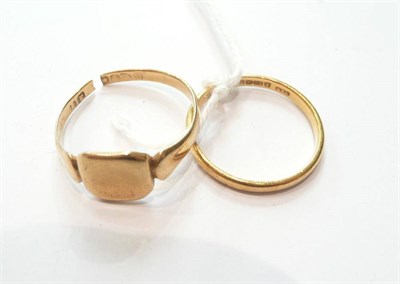 Lot 80 - A 22ct gold band ring and an 18ct gold signet ring (shank snapped)