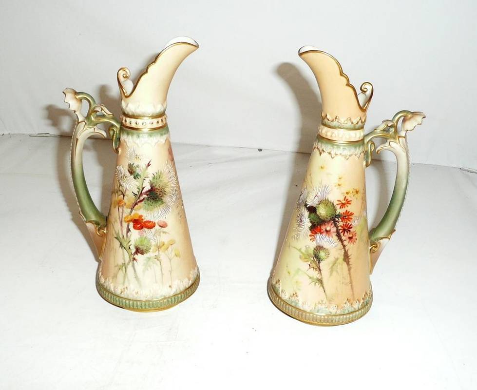 Lot 93 - Pair of Royal Worcester blush ivory jugs decorated with thistles
