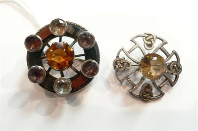 Lot 174 - A Victorian Scottish hardstone brooch and another later, in a similar style