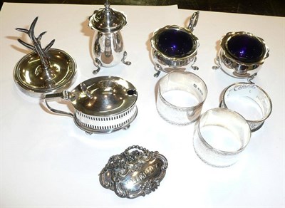 Lot 177 - A three piece silver cruet, a mustard pot, three napkin rings, a ring tree, two plated wine labels