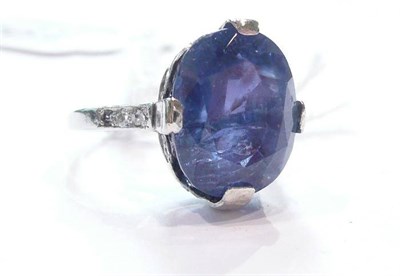 Lot 194 - A sapphire and diamond ring (flawed)