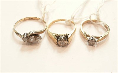 Lot 199 - Two diamond solitaires rings and a three stone ring