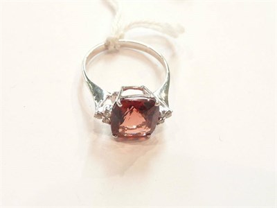 Lot 205 - An 18ct white gold garnet and diamond ring