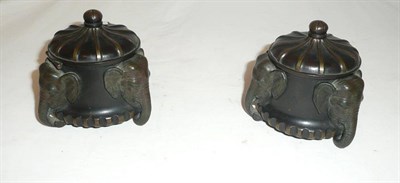 Lot 220 - Pair of bronze inkwells with elephant decoration