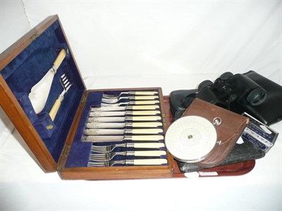 Lot 231 - A Fowler's calculator, an oak canteen of plated fish servers, a camera, two pairs of...