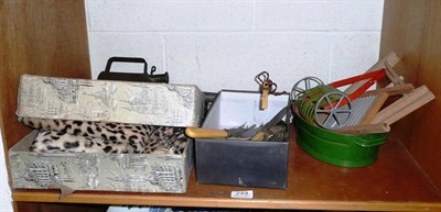 Lot 249 - Box of cheetah skins, an oil can, a light fitting, a miniature mangle 'Triang' and laundry set...