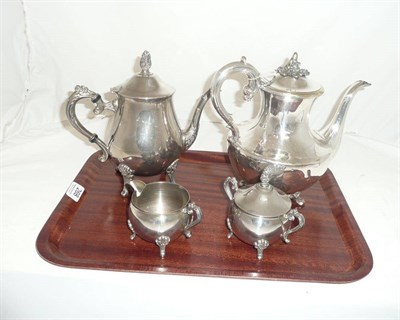 Lot 268 - A plated teapot and a plated three piece tea set