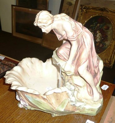 Lot 311 - Royal Dux Art Nouveau maiden sat on a rock looking into a pond