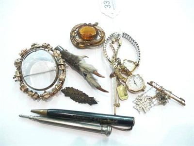 Lot 331 - A Victorian locket brooch, a brooch, a spider brooch stamped "9CT" (a/f), a silver "MOTHER" brooch