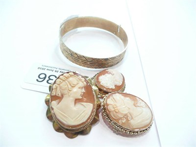 Lot 336 - Three cameo brooches and gold bangle