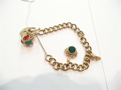 Lot 365 - Gold charm bracelet hung with three charms