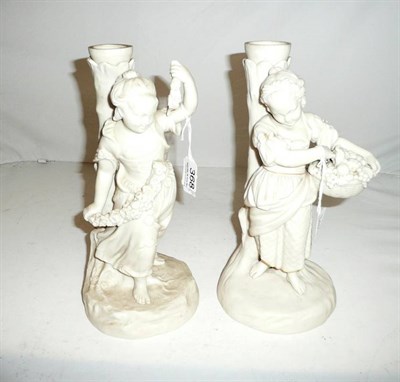 Lot 368 - Parian - Copeland, Pair of candlesticks of two girls, garland broken, one basket of fruit...