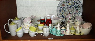 Lot 393 - A shelf of Poole pottery including plates, condiments, teawares and plate by Donna Ridout