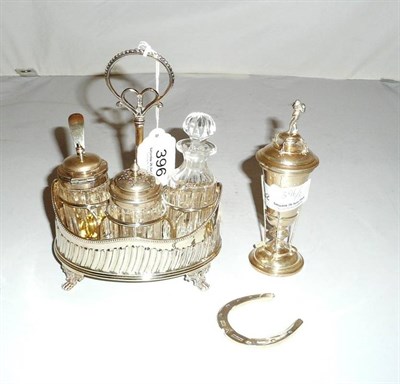 Lot 396 - A silver golfing trophy, silver horseshoe and a condiment set