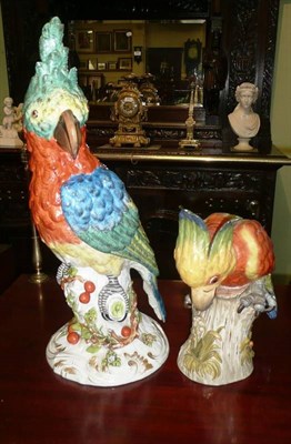 Lot 424 - Continental porcelain parrot and another