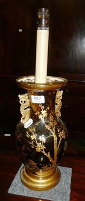 Lot 427 - Pair of black and gilt ceramic table lamps