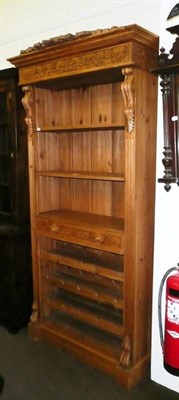 Lot 522 - Reproduction carved pine bookcase with bottle rack