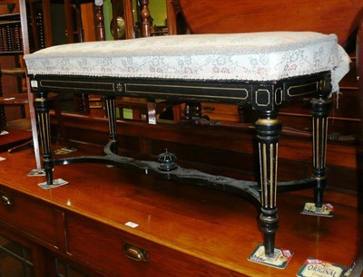 Lot 545 - An ebonised and gilt duet stool