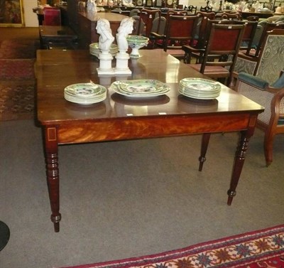 Lot 572 - Early 19th century mahogany two section dining table with leaf