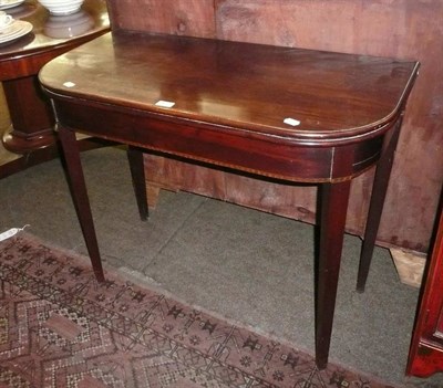 Lot 577 - A 19th century mahogany foldover tea table