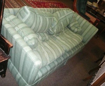 Lot 585 - Green two seater sofa