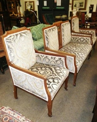 Lot 587 - Edwardian inlaid mahogany sofa and two matching elbow chairs