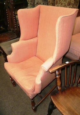 Lot 605 - Upholstered wing back chair