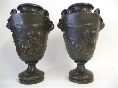 Lot 1173 - After Clodion: A Pair of Bronze Two-Handled Pedestal Vases, 19th century, each with goat mask...