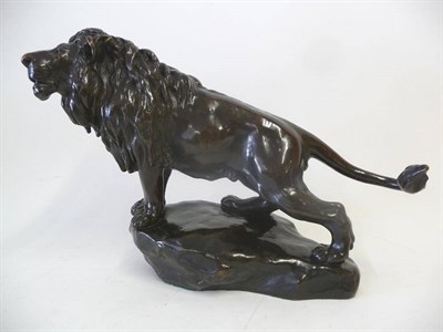 Lot 1174 - French School, late 19th century: A Bronzed Metal Figure of a Male Lion, in roaring pose, stood...