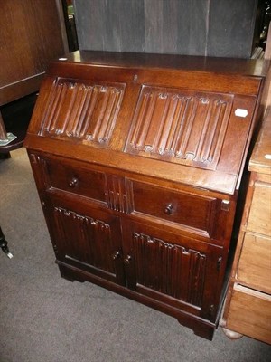 Lot 648 - Reproduction 'Heathland' furniture, oak linen blanket box and matching bureau