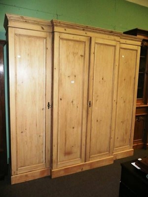 Lot 653 - Pine breakfront wardrobe