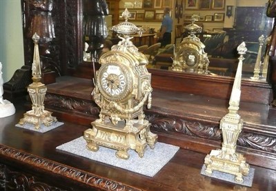 Lot 669 - French brass clock garniture signed G Philippe, France