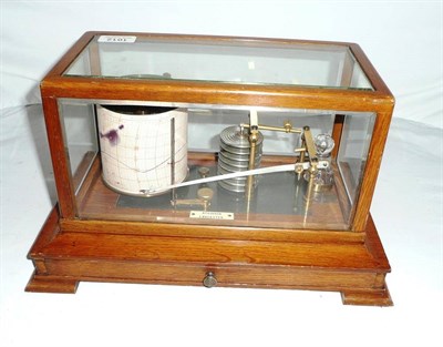 Lot 1012 - An Oak Cased Barograph by Atkinson, Lancaster, with eight section vacuum, ivorine name tablet,...