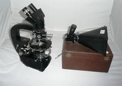 Lot 1021 - A Black Enamelled Binocular Compound Microscope by Cooke, Troughton & Simms, model M7576, the...