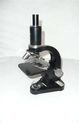 Lot 1024 - A Black Enamelled Microscope by Ernst Leitz, serial number 587083, with binocular attachment, three