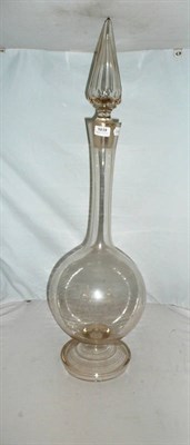 Lot 1039 - A Chemist's Clear Glass Show Globe, of shaft and globe form, with faceted conical stopper, on a...