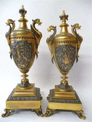 Lot 1191 - A Pair of French Gilded and Silvered Brass Vase Side Pieces, circa 1850, with winged dragon...