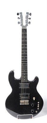 Lot 1058 - A Kramer 450G Solid Body Electric Guitar, with aluminium forked head, black finished mahogany body