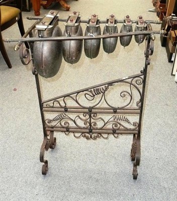 Lot 1092 - A Floor Standing Glockenspiel, with ornate wrought iron stand, six graduated brass keys mounted...