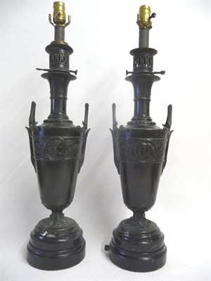 Lot 1197 - A Pair of Bronze Classical Lamps, French, 19th century, as two-handled baluster vases with...