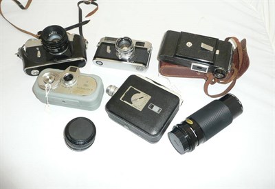 Lot 1110 - A Canon Model 7 Camera No.837482, with chrome body and f1.8/50mm lens no.146543, together with...