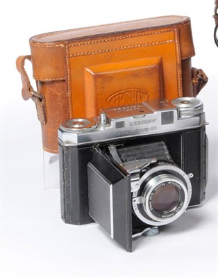 Lot 1120 - A Kershaw Peregrine III Folding Rollfilm Camera No.4/26056, with leather covered chrome body,...