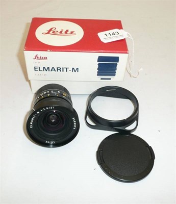 Lot 1143 - A Boxed Leica Elmarit-M f2.8/21mm Lens No.11134, in black, with bayonet mount, lens hood,...