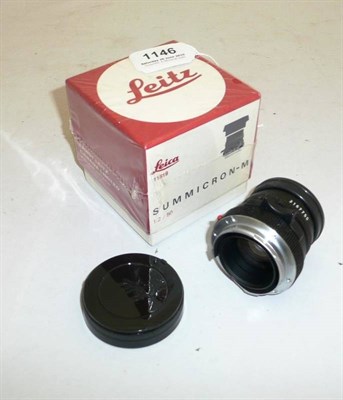 Lot 1146 - A Boxed Leica Summicron-M f2/50mm Lens No.11819, in black, with bayonet mount and original card box