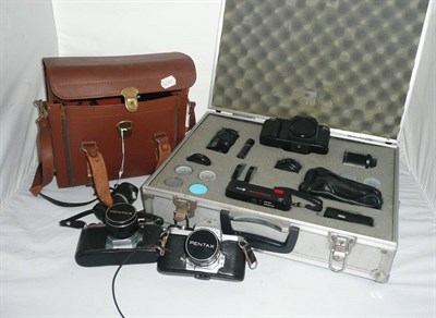 Lot 1168 - Cameras and Accessories, including a Canon T50 outfit in aluminium attache case, Olympus-Pen...