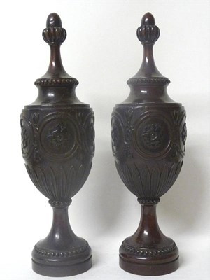 Lot 1210 - A Pair of Turned and Carved Mahogany Pedestal Vase Ornaments, circa 1780, with fluted acorn...